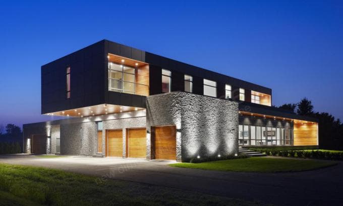 Norstone Charcoal Rock Panels used as a primary stone siding feature on a large modern designed home in Niagra Falls